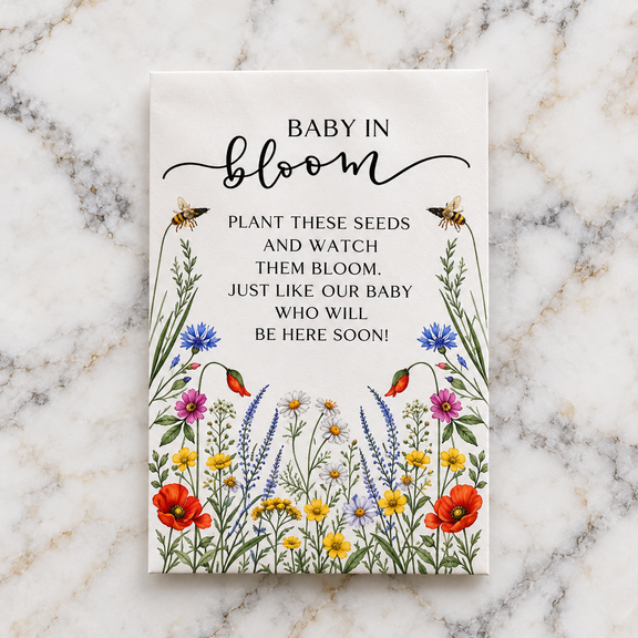 The Baby in Bloom wildflower seed packet, illustrated with poppies, cornflowers and daisies, reading Plant these seeds and watch them bloom
